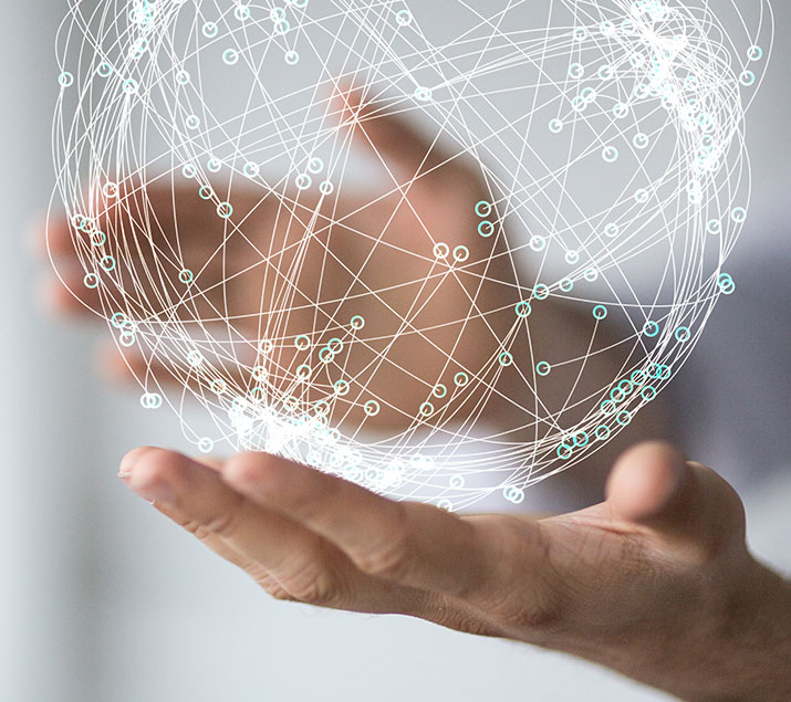 image-service1 image of a person holding a sphere of networking lines